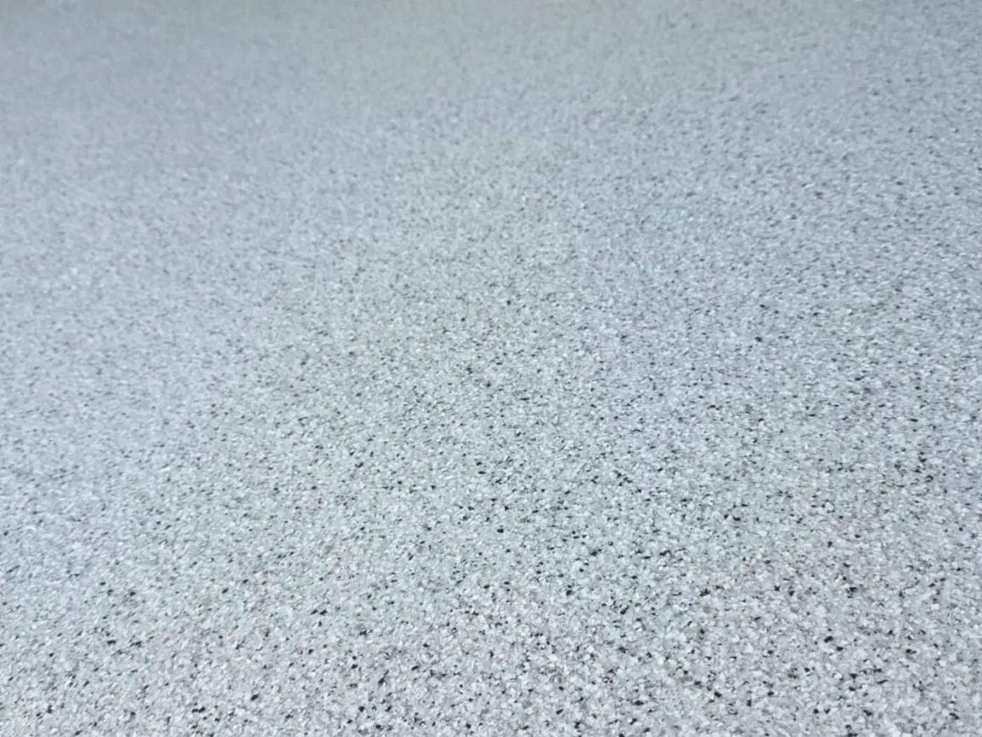 Close-up of fine flake epoxy floor finish — King of Seal Sydney