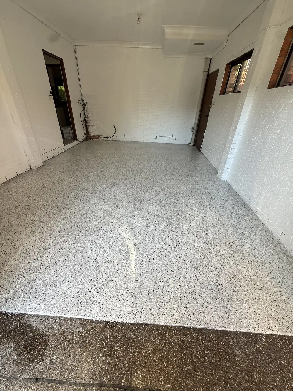 Decorative flake epoxy floor in residential utility room — Chatswood, Sydney