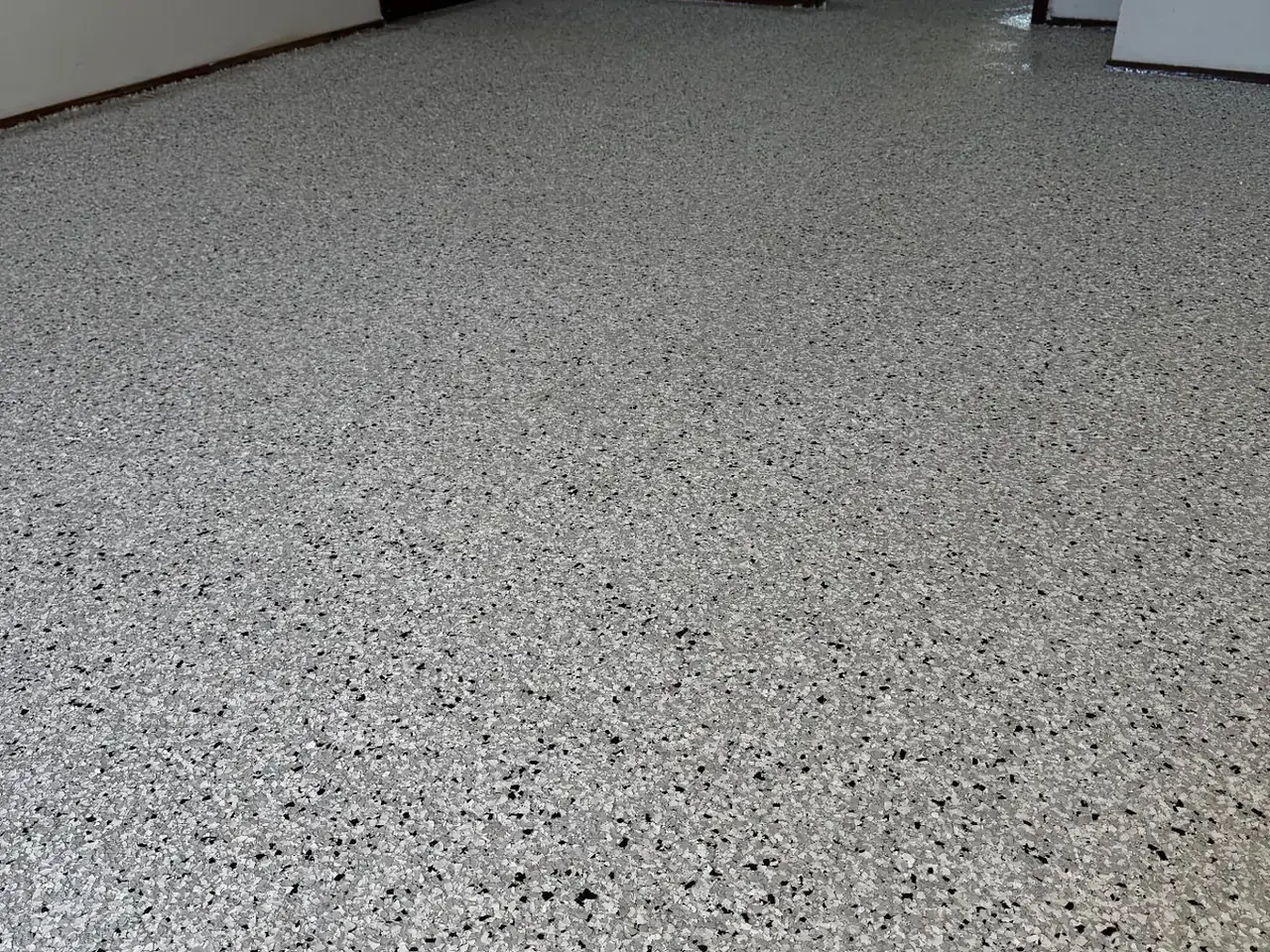 Decorative flake epoxy floor in a residential living area — King of Seal Sydney