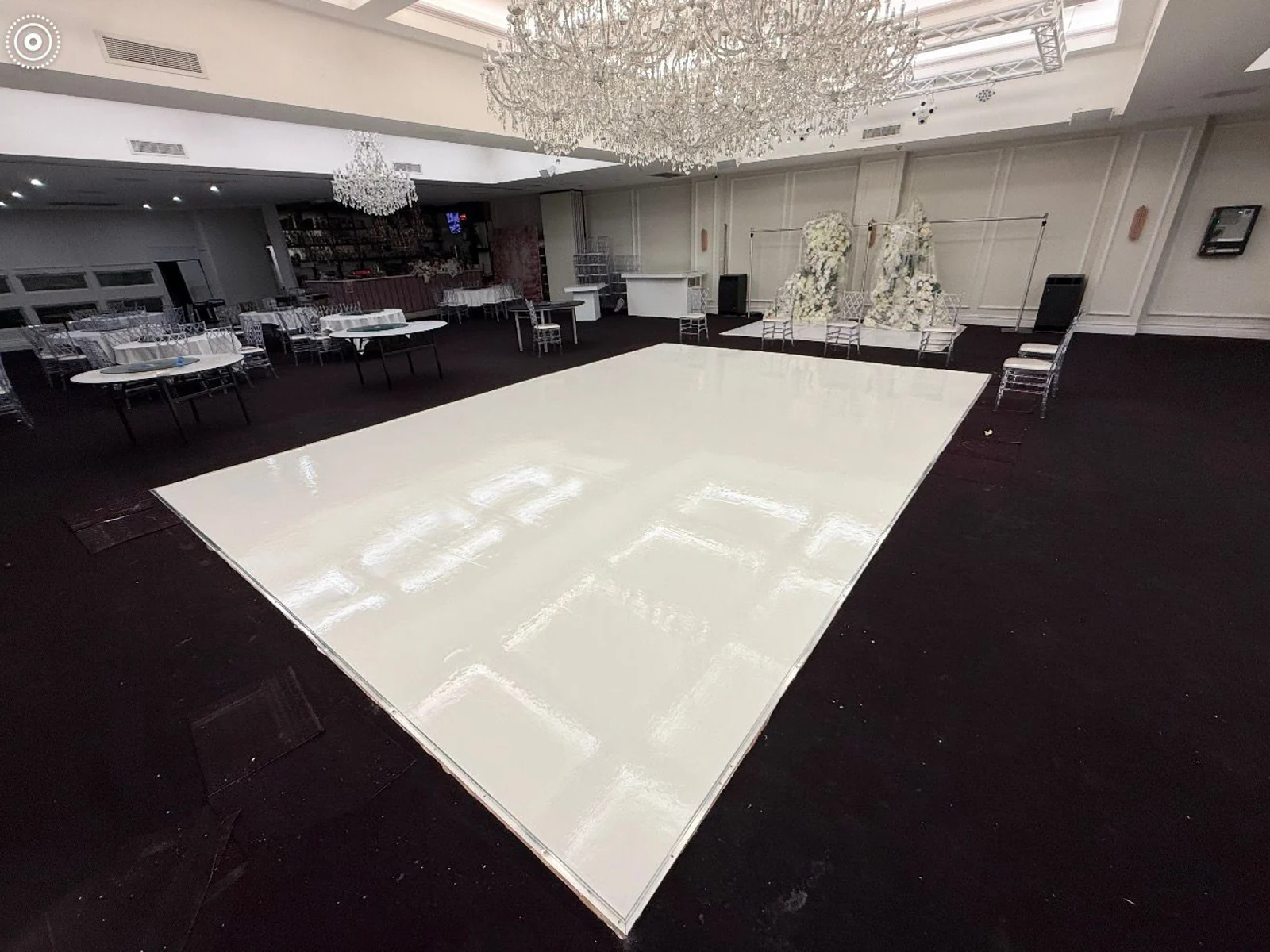 High-gloss white solid colour epoxy dance floor in a chandeliered wedding venue — King of Seal Sydney
