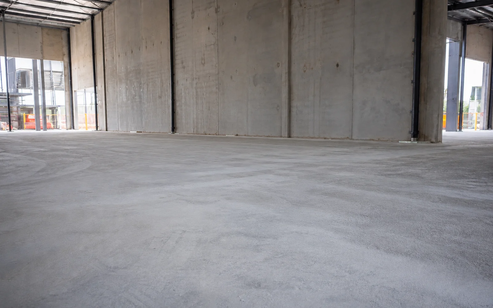 Polished and prepped warehouse concrete slab ready for finishing — Trade Subcontract by King of Seal Sydney