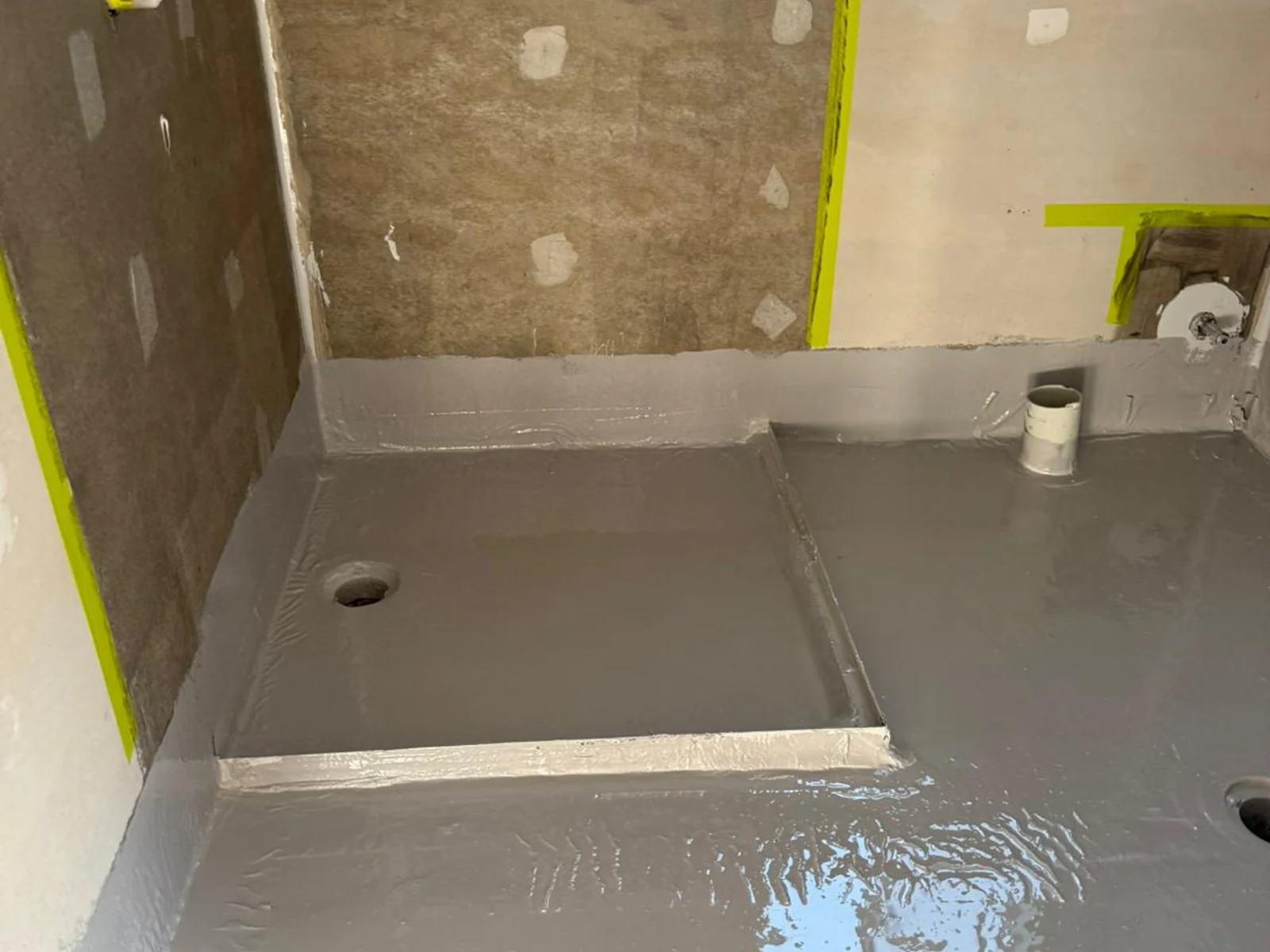 Bathroom shower base waterproofed with grey membrane on floor and walls — King of Seal Sydney